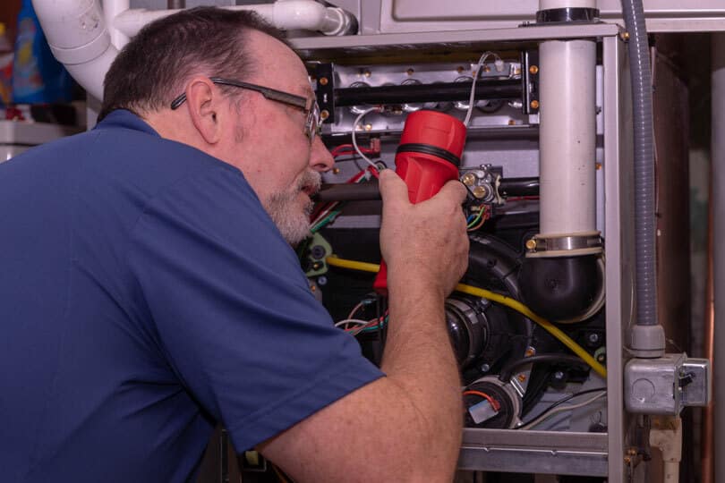 A tech working on a furnace