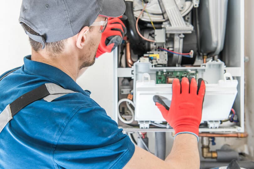 A tech working on a furnace